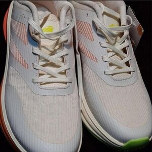 White and Pink Athletic Shoes